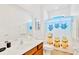 Bright bathroom with a shower/tub combo and a minion-themed shower curtain at 2610 Calistoga Ave, Kissimmee, FL 34741