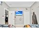 Bedroom with mounted TV, Star Wars wall art, and a door to another room at 2610 Calistoga Ave, Kissimmee, FL 34741