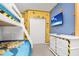 Minions themed bedroom with bunk beds, TV, and ample storage at 2610 Calistoga Ave, Kissimmee, FL 34741
