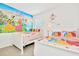 Princess themed bedroom with twin beds, Disney princess wall mural, and themed bedding at 2610 Calistoga Ave, Kissimmee, FL 34741