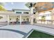 Relaxing community patio with seating and a view of the pool at 2610 Calistoga Ave, Kissimmee, FL 34741
