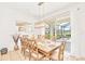 Bright dining room with wooden table and view to backyard at 2610 Calistoga Ave, Kissimmee, FL 34741