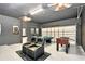 Game room featuring a pool table, foosball table, and two recliner chairs at 2610 Calistoga Ave, Kissimmee, FL 34741