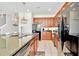 Modern kitchen with granite countertops and wood cabinets at 2610 Calistoga Ave, Kissimmee, FL 34741