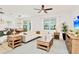 Spacious living room with L-shaped sofa and wood furniture at 2610 Calistoga Ave, Kissimmee, FL 34741