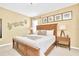 King-size bed, nightstands with lamps, and an elegant wooden frame at 2610 Calistoga Ave, Kissimmee, FL 34741