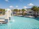 Large resort-style pool with a waterfall feature and plenty of lounge chairs at 2610 Calistoga Ave, Kissimmee, FL 34741