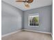 Simple bedroom with light grey walls and wood-look floors at 2748 River Landing Dr, Sanford, FL 32771