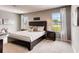 Spacious bedroom with large bed and window views at 3475 Sandalwood Isle Way, Ocoee, FL 34761