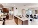 Modern kitchen with granite countertops and stainless steel appliances at 3475 Sandalwood Isle Way, Ocoee, FL 34761