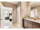 Guest bathroom with granite vanity and view of bedroom at 3475 Sandalwood Isle Way, Ocoee, FL 34761