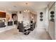 Modern dining room with glass table and black chairs at 3475 Sandalwood Isle Way, Ocoee, FL 34761