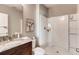 Clean bathroom with shower and granite vanity at 3475 Sandalwood Isle Way, Ocoee, FL 34761