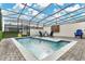 Enjoy this refreshing screened pool with patio furniture at 3894 Lana Ave, Davenport, FL 33897