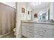 Bathroom with granite countertop, double sinks, and shower at 3894 Lana Ave, Davenport, FL 33897