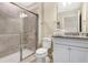 Bathroom with granite countertop and walk-in shower at 3894 Lana Ave, Davenport, FL 33897