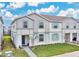 Two story townhome with light gray siding at 3894 Lana Ave, Davenport, FL 33897