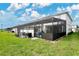 View of home's exterior and private backyard at 3894 Lana Ave, Davenport, FL 33897