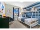 Bright bedroom with a bunk bed, window, and TV at 3894 Lana Ave, Davenport, FL 33897