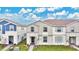 Two story townhome with light gray siding at 3894 Lana Ave, Davenport, FL 33897