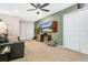 Game room with a leather couch and a large TV at 3894 Lana Ave, Davenport, FL 33897