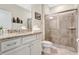 Clean bathroom with granite countertop and walk-in shower at 3894 Lana Ave, Davenport, FL 33897