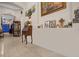 Bright entryway with decorative wooden secretary and framed artwork at 4001 Scarlet Branch Rd, Orlando, FL 32824