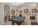 Game room with pool table and decorative wall accents at 4001 Scarlet Branch Rd, Orlando, FL 32824