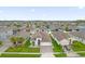 An aerial view showcasing a residential neighborhood with houses and landscaping at 4001 Scarlet Branch Rd, Orlando, FL 32824