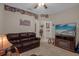 Relaxing living room with a brown leather couch and fireplace at 4001 Scarlet Branch Rd, Orlando, FL 32824