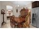 A dining room with a wooden table and ornate chairs at 4001 Scarlet Branch Rd, Orlando, FL 32824