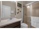 Clean bathroom with a shower/tub combo and dark wood vanity at 4001 Scarlet Branch Rd, Orlando, FL 32824