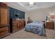 Well-lit bedroom with dresser and large bed at 4001 Scarlet Branch Rd, Orlando, FL 32824