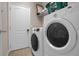 Laundry room with washer, dryer, and ample storage at 4001 Scarlet Branch Rd, Orlando, FL 32824