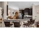 Kitchen with dark cabinets, granite countertops, and stainless steel appliances at 4001 Scarlet Branch Rd, Orlando, FL 32824
