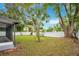 Large backyard with a white privacy fence at 627 Carvell Dr, Winter Park, FL 32792