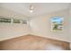 Spacious bedroom with light walls and wood-look floors at 627 Carvell Dr, Winter Park, FL 32792