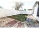 Backyard with brick patio, grassy area, and white fence at 6632 Meritmoor, Orlando, FL 32818