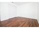 Empty bedroom with double door closet and wood-look floors at 6632 Meritmoor, Orlando, FL 32818