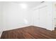 Bedroom with wood-look floors and double door closet at 6632 Meritmoor, Orlando, FL 32818