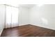 Bedroom with wood-look floors and sheer curtains at 6632 Meritmoor, Orlando, FL 32818