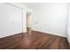 Bedroom with wood-look floors and access to hallway at 6632 Meritmoor, Orlando, FL 32818
