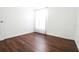 Bright bedroom with wood-look floors and window at 6632 Meritmoor, Orlando, FL 32818