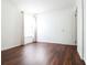 Bright bedroom with wood-look floors and large window at 6632 Meritmoor, Orlando, FL 32818