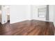 Spacious bedroom featuring wood floors and large window at 6632 Meritmoor, Orlando, FL 32818