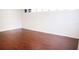 Simple bedroom with wood-look flooring and large window at 6632 Meritmoor, Orlando, FL 32818