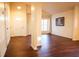 Entryway with hardwood floors and an open view to living area at 6632 Meritmoor, Orlando, FL 32818