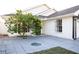 House entrance with a security door and a citrus tree at 6632 Meritmoor, Orlando, FL 32818