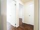 Hallway with wood-look floors and access to bedrooms at 6632 Meritmoor, Orlando, FL 32818