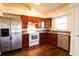 Modern kitchen with stainless steel appliances and granite countertops at 6632 Meritmoor, Orlando, FL 32818